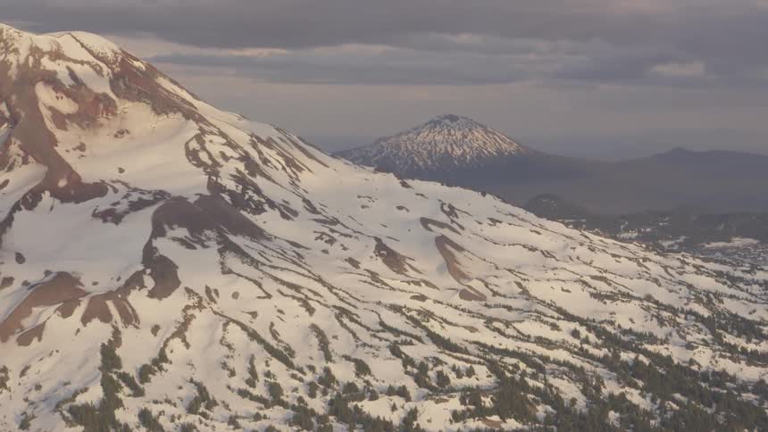 Pilot Flying Plane Through Snowy Mountains