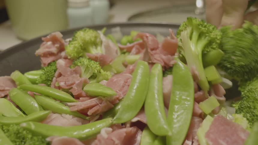 Person Making Food In The Kitchen