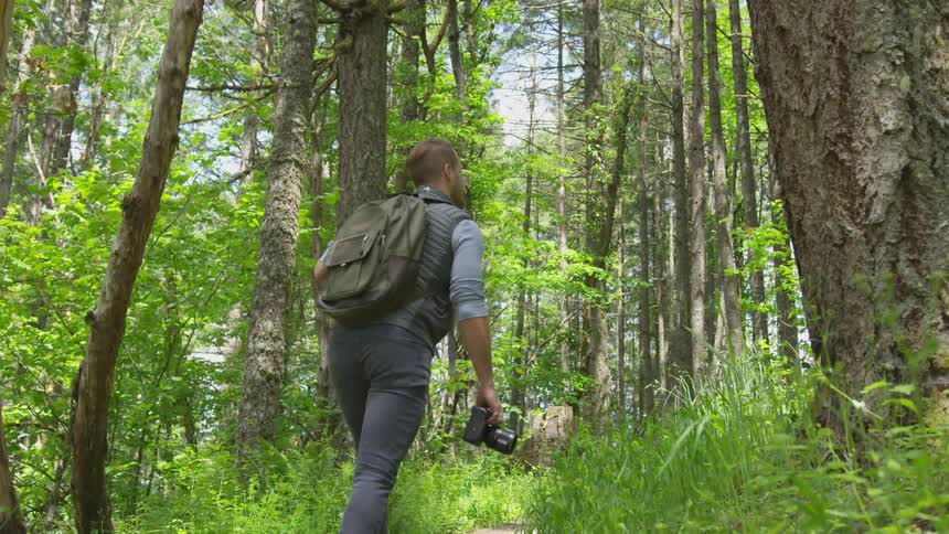 Photographer Hiking In Nature
