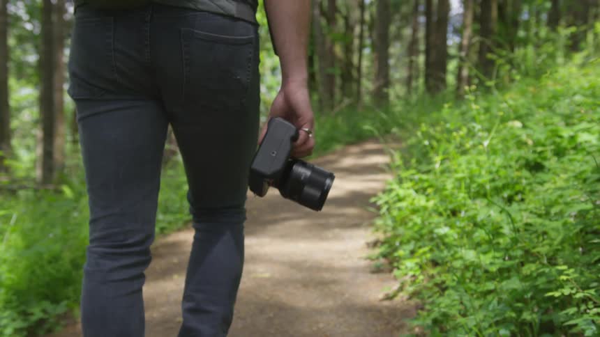 Photographer Hiking In Nature