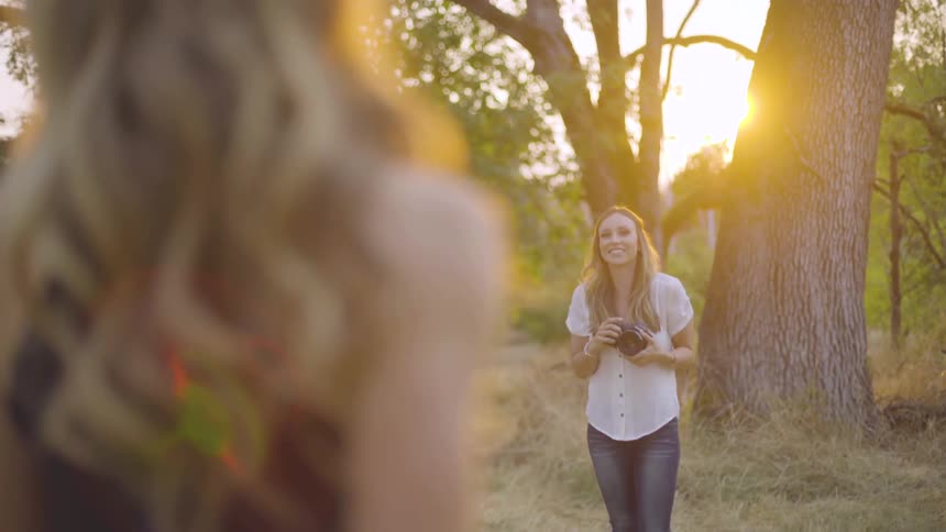 Photographer Taking Pictures Of Woman