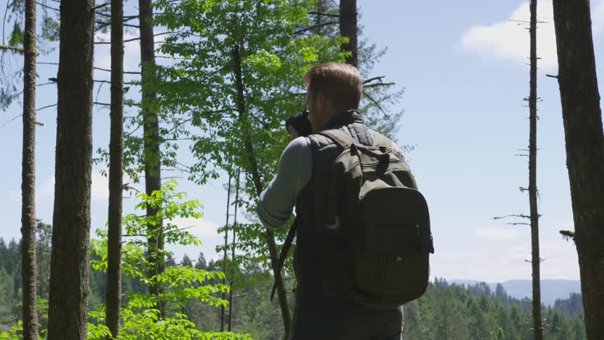 Photographer Hiking In Nature