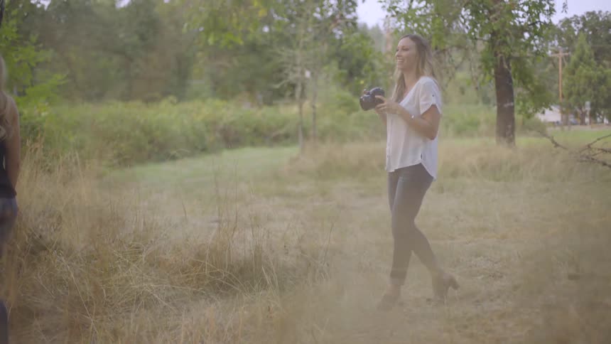 Photographer Taking Pictures Of Woman