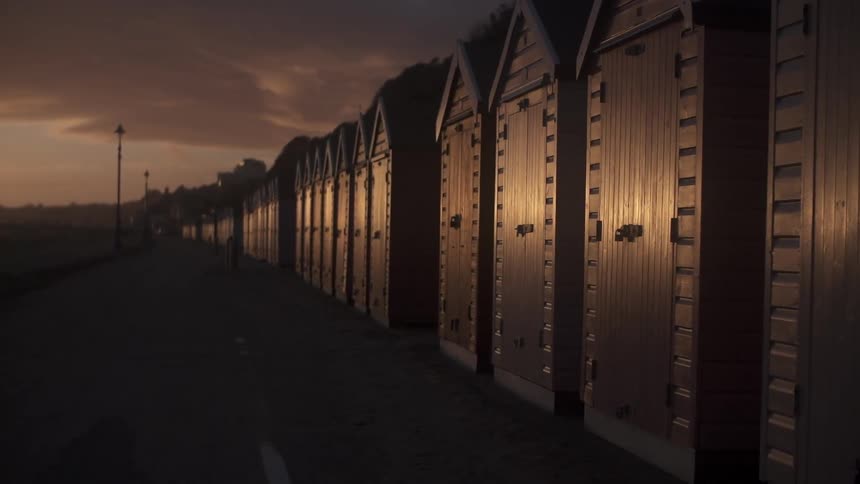 A view of a long row of storage sheds at dusk
