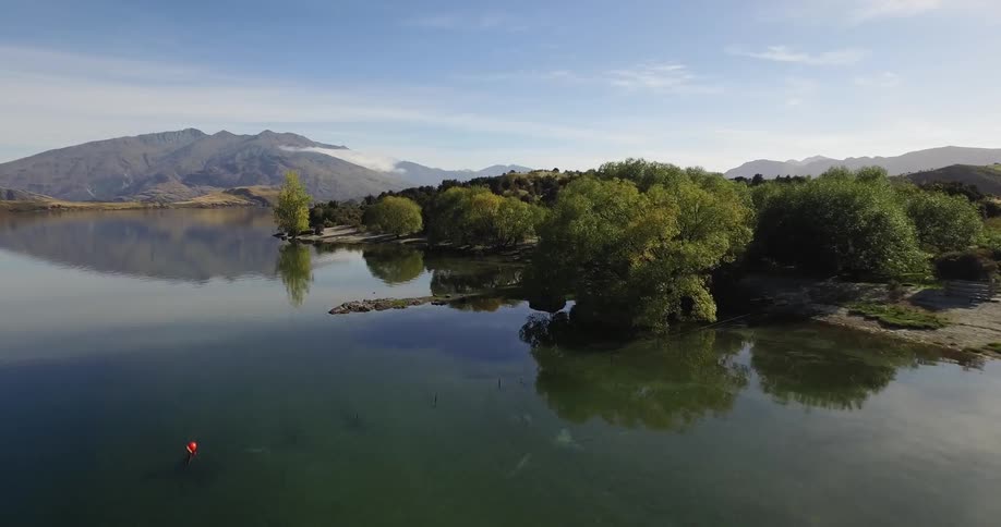 Taking off from a lake in a remote area then flying towards some hills