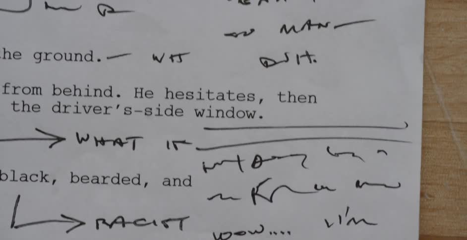 Pages with corrections being flipped on a desk