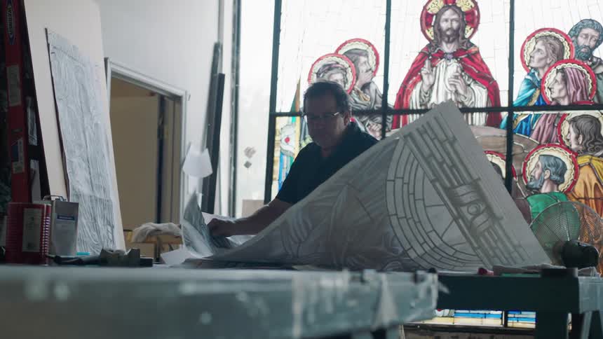 Large studio with artist moving pieces