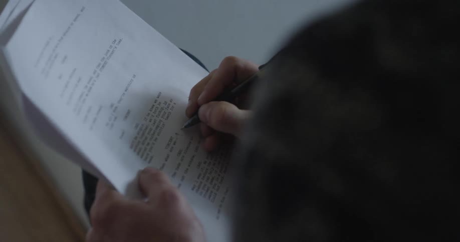A man making notes on a piece of paper