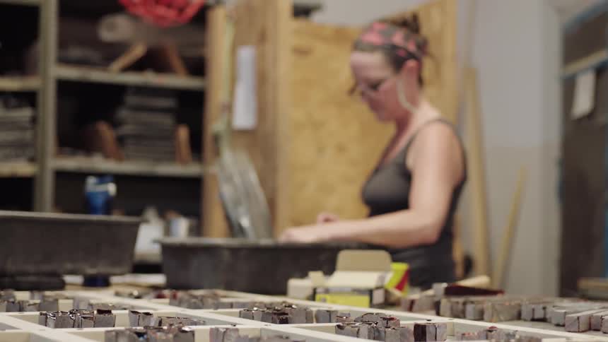 Young woman organizing studio