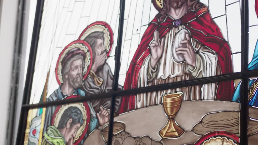 Artists looking at stain glass artwork