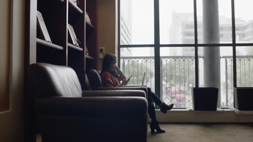 Large armchair with woman making a phone call