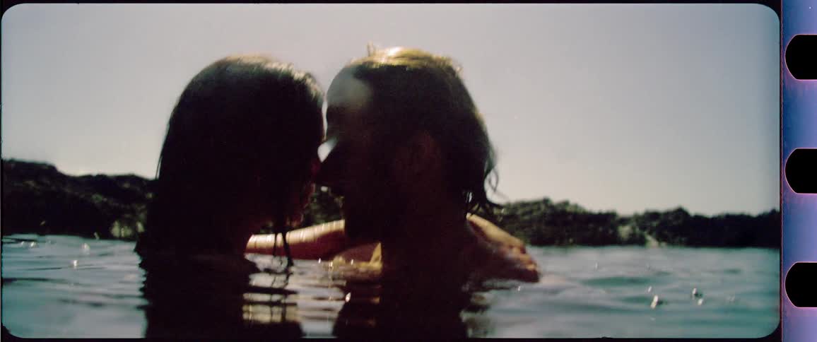Couple kissing in the water