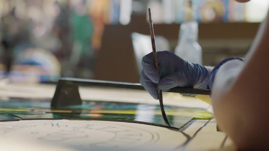 Slow moving paint brush across artwork