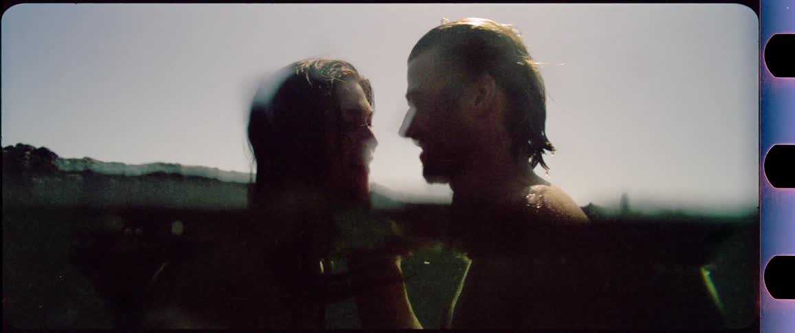 Couple kissing in the water
