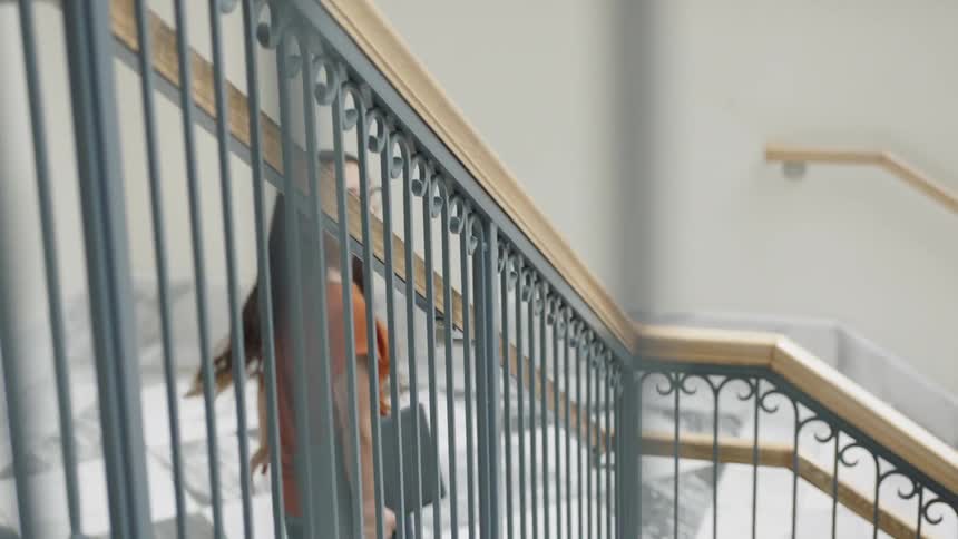Woman walking down stairs
