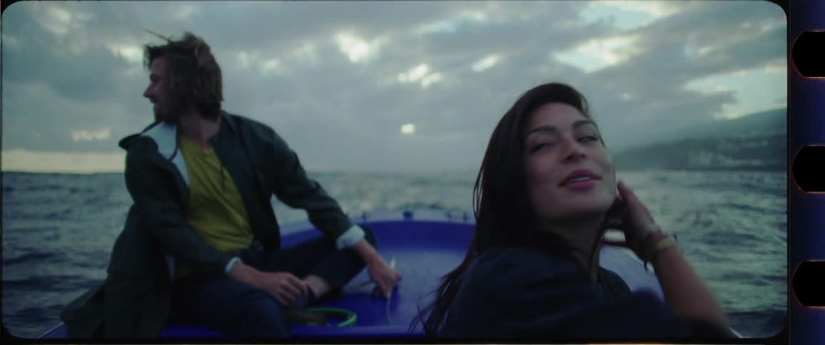Couple having fun on a boat on the ocean