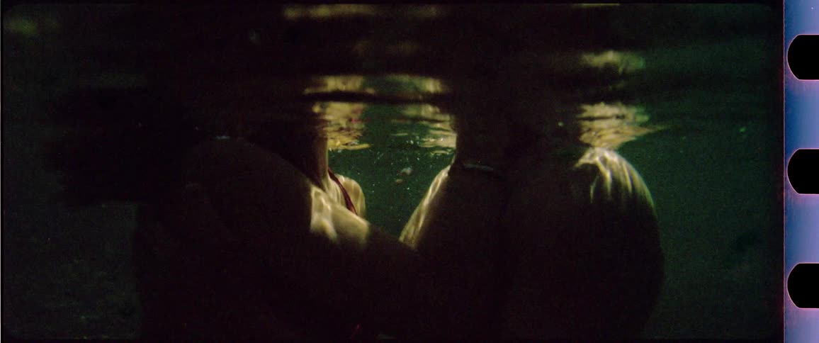 Couple kissing in the water