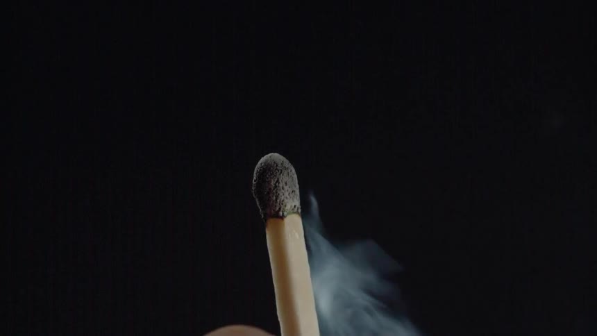 A burning match is blown out