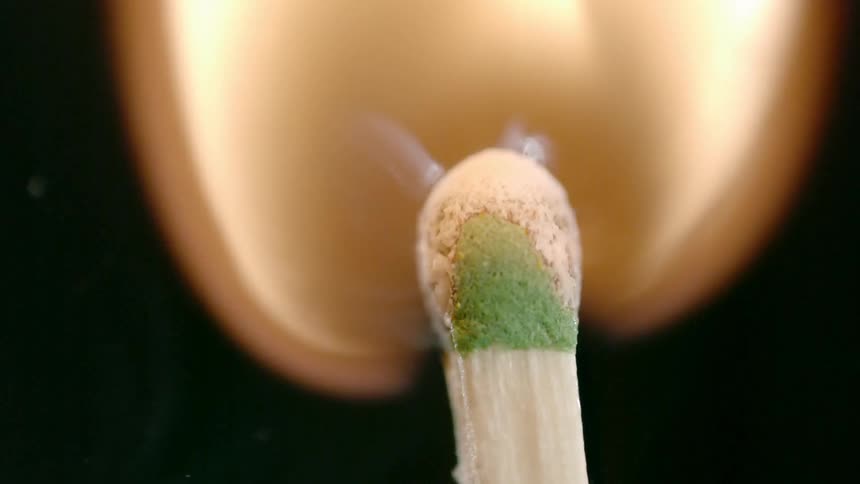 A match head burning and flaming