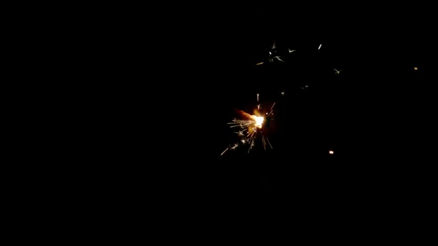 Sparks flying in a dark room