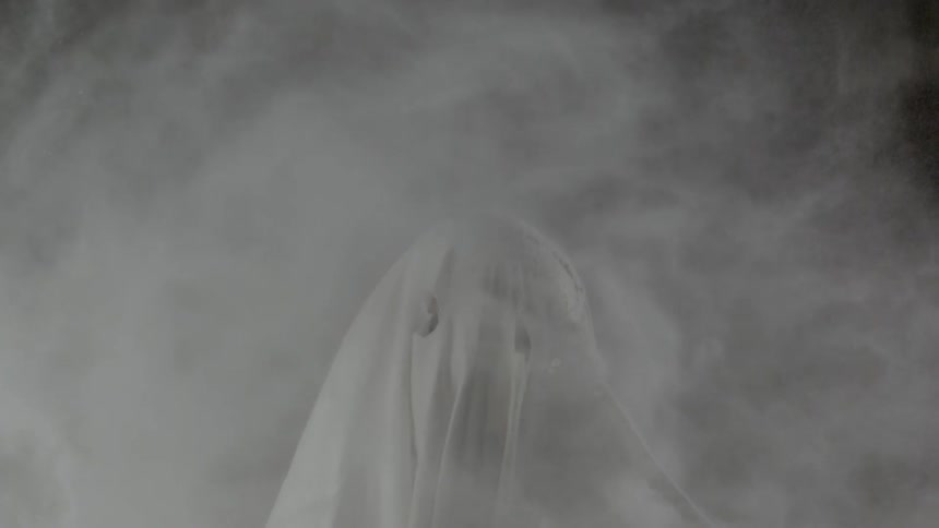 Dust billowing around a white figure
