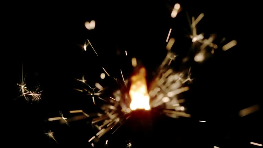Sparks emanating from a burning object