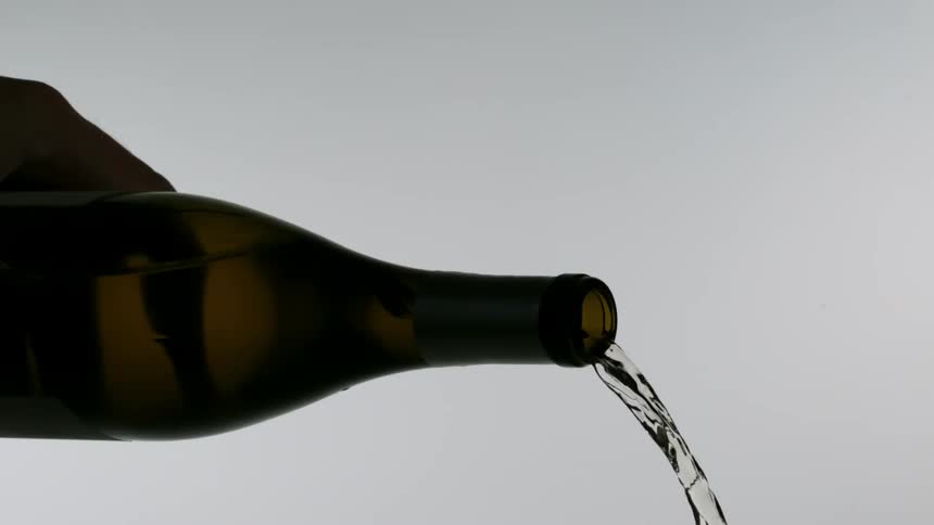 Water poured from a brown bottle