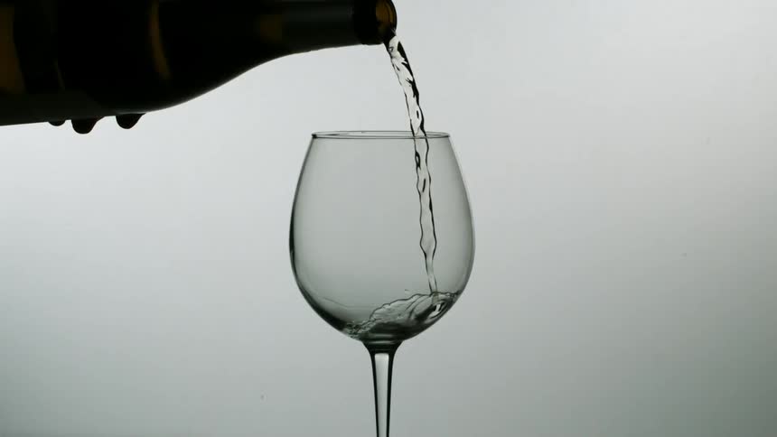Wine being poured into a wine glass