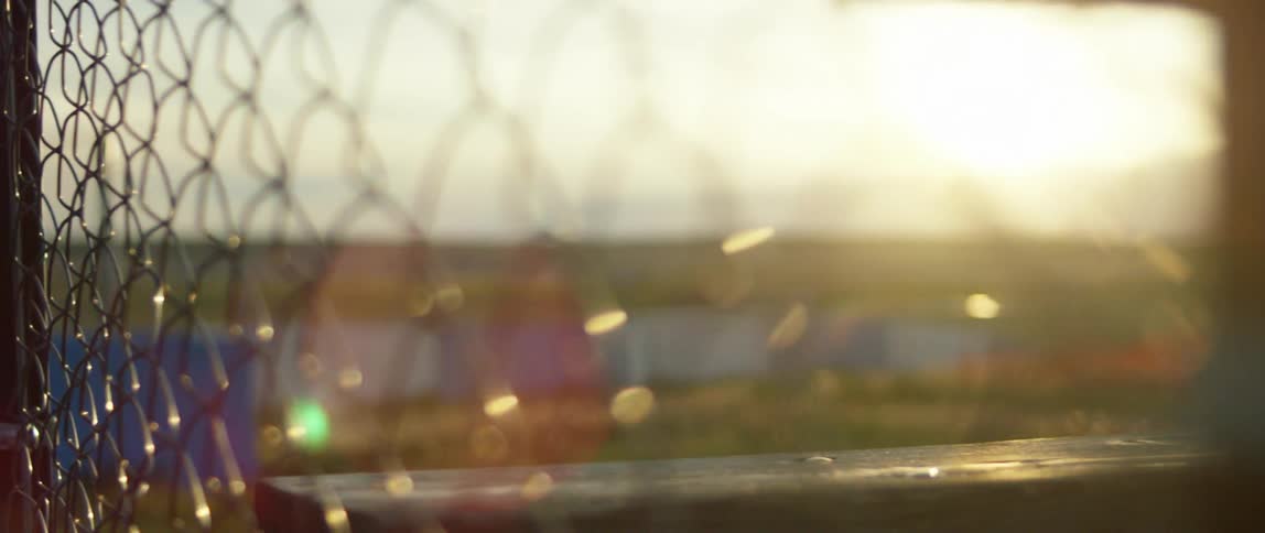 Close up view of a chain link fence on a sunny day