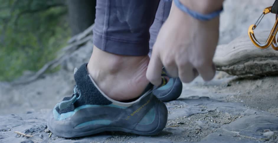 Woman Rock Climbing In Nature