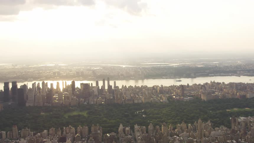 The lush greenness of New York's central park stands in stark contrast to the countless skyscrapers that surround it