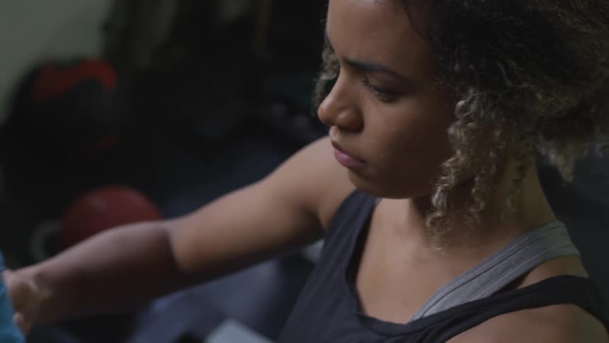 A woman is wrapping her right hand