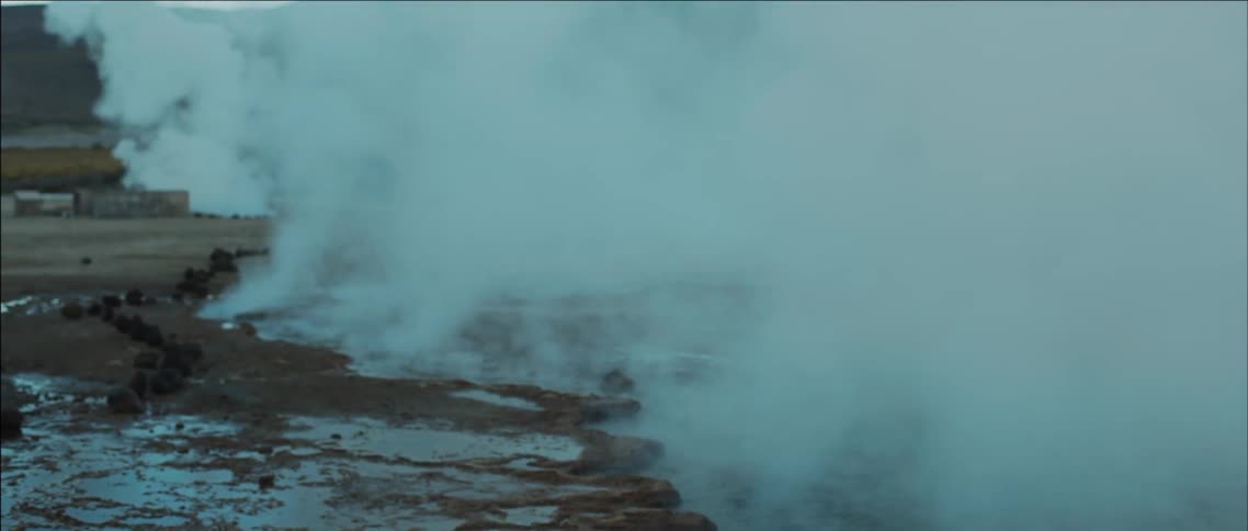 Steam rises from the ground in the wilderness