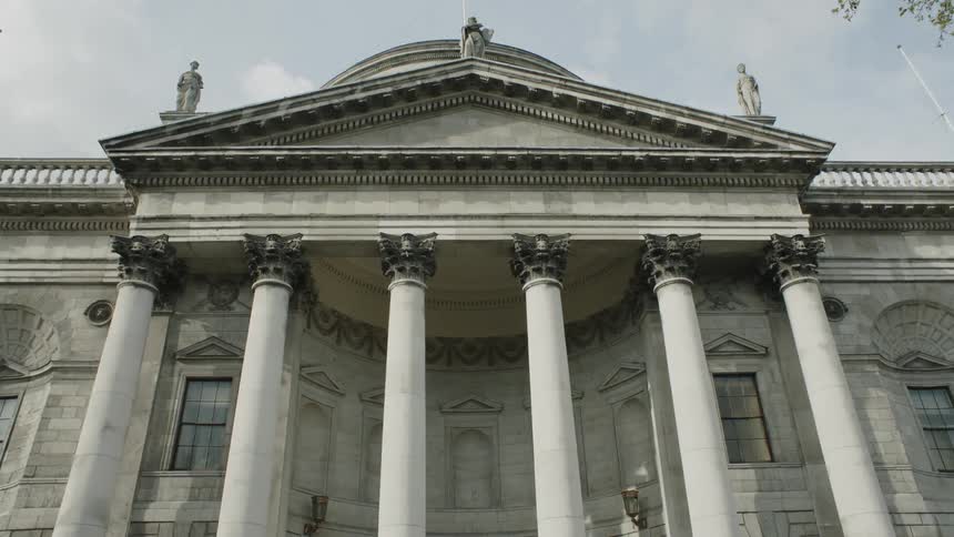 The edifice of an old building with columns