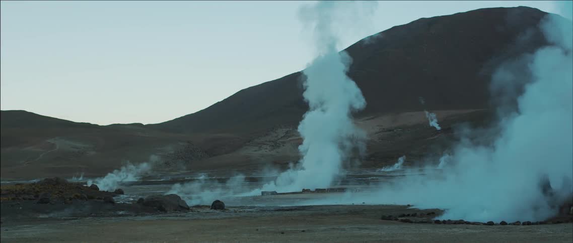 Steam rises from the ground in the wilderness