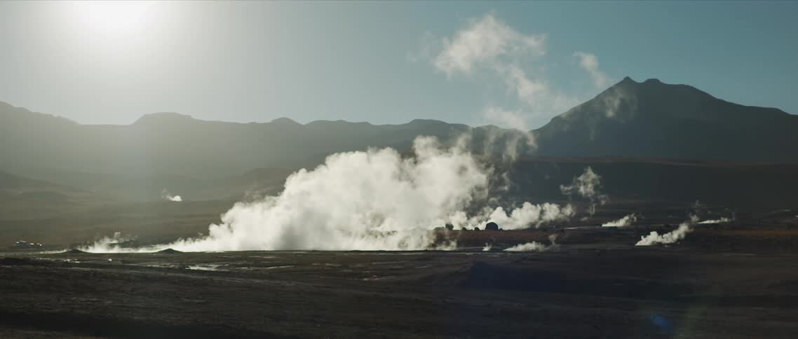Steam rises from the ground in the wilderness