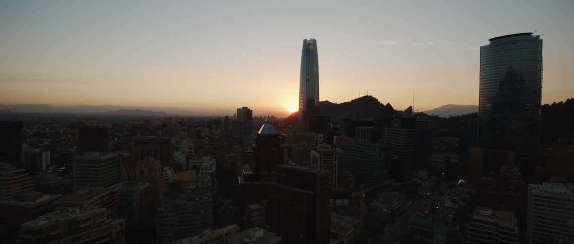 City buildings stand tall at sunset