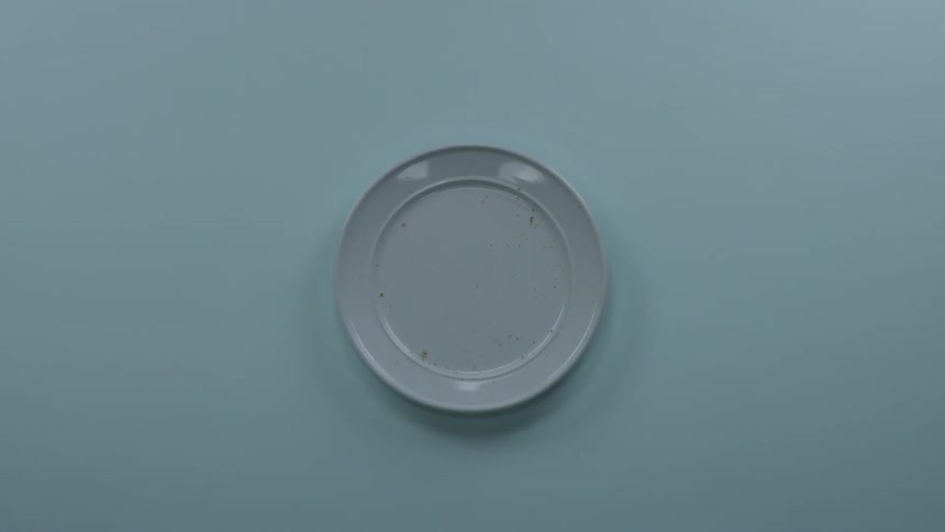 A person picking up a cookie and taking a bite then putting it back