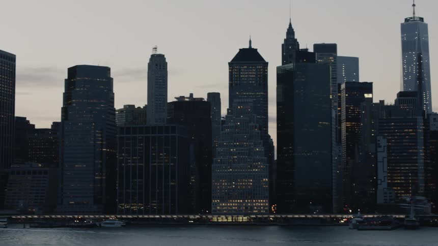 A large city is lit on a cloudy day