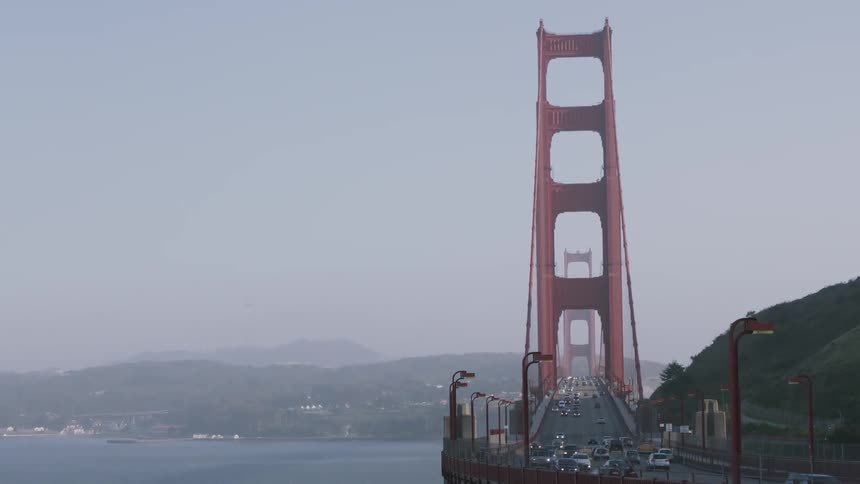 Cars cross a city bridge