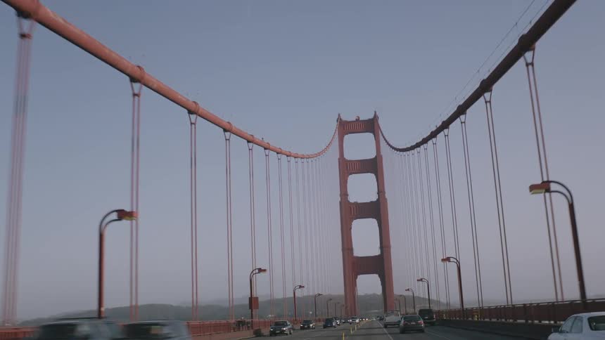 Vehicles cross a city bridge