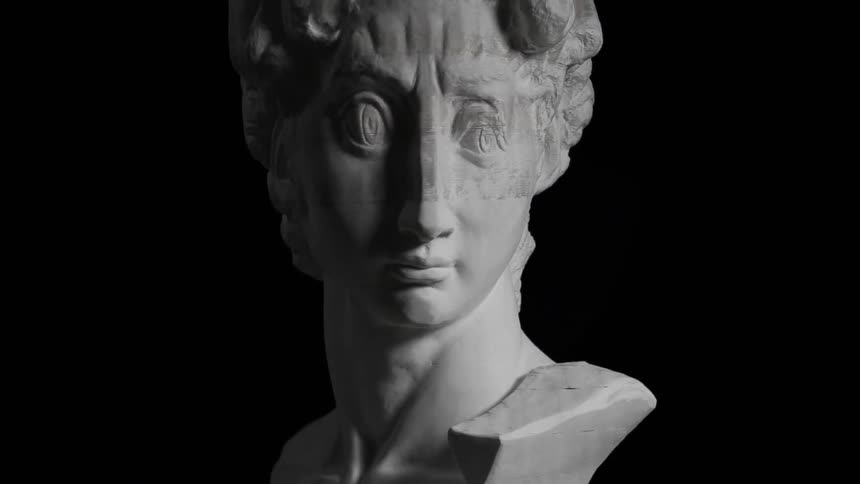 A statue is stretched and compressed