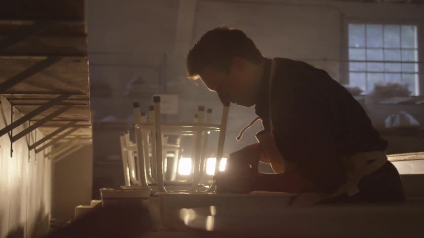 A man working in a dark shop