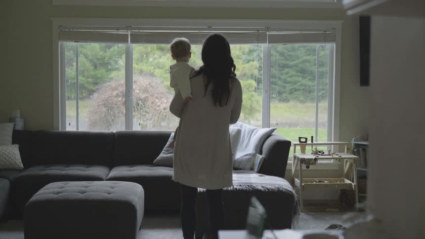 A woman holding a child