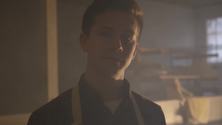 Teen looks directly into the camera with an intense stare