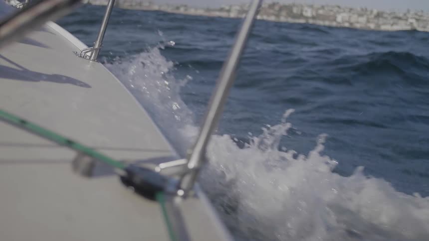 A motor boat causing waves as it travels through a body of water