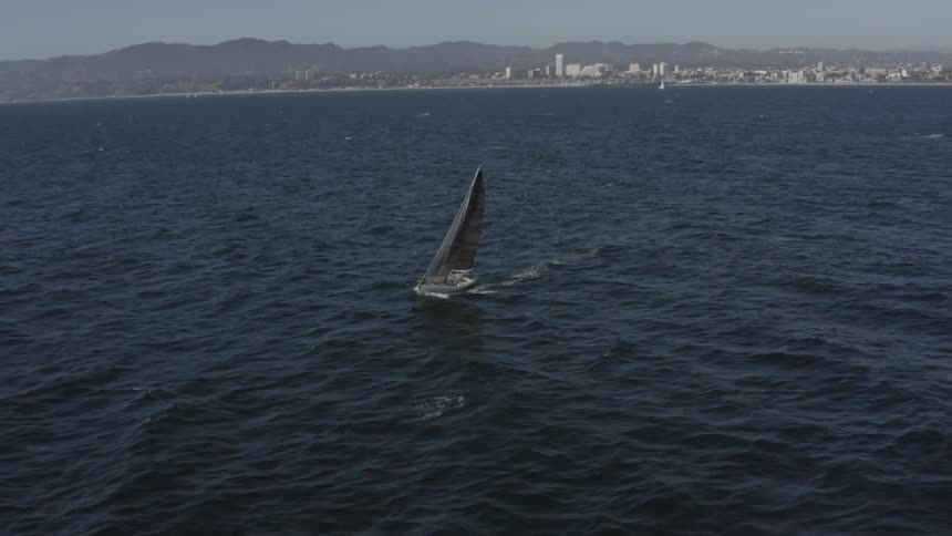 Boat sails on choppy water