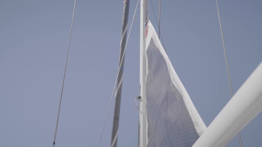 Wind is blowing the flag on a boat