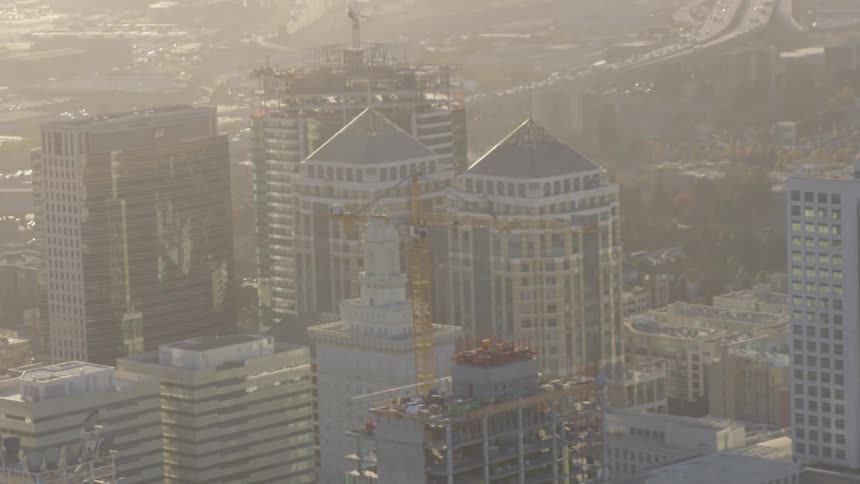 A city skyline with a freeway in the background