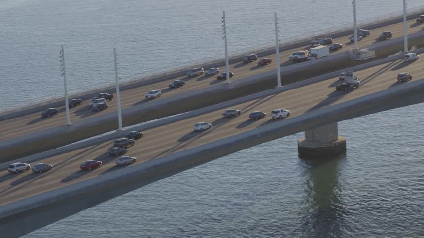 Vehicles driving on a bridge over water